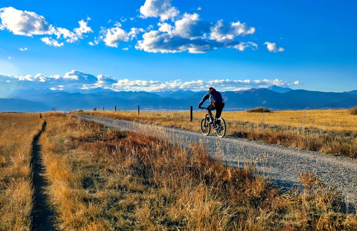 person riding a mountain bike in Colorado - staying active